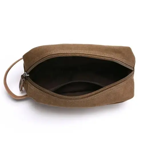 Rugged waxed canvas travel pouch in a vintage adventure setting, ideal for outdoor and lifestyle brand promotions